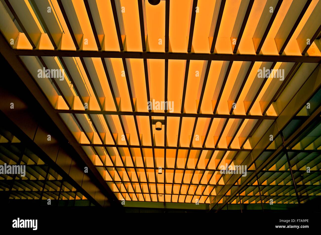 Open roof of a modern building with long strip made from steel pipe Stock Photo