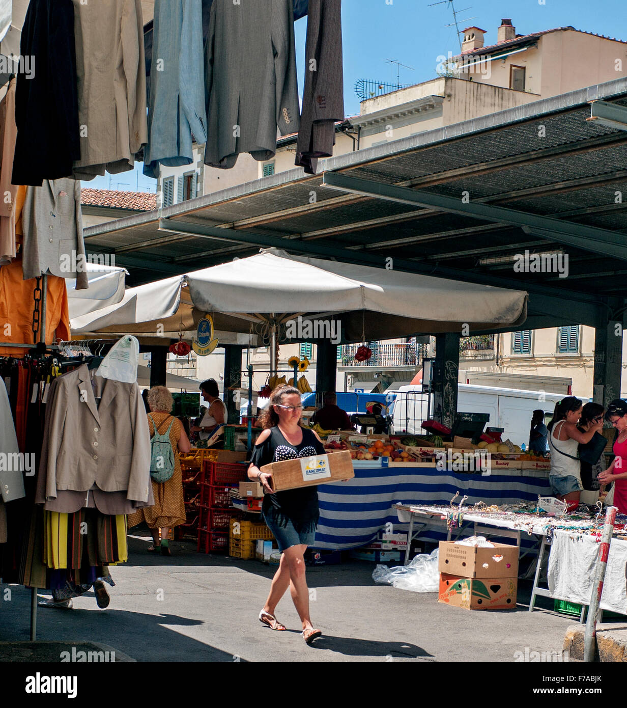 clothes hanging in Market and fruit and veg stalls at the Sant' Ambrogio market Florence Stock Photo