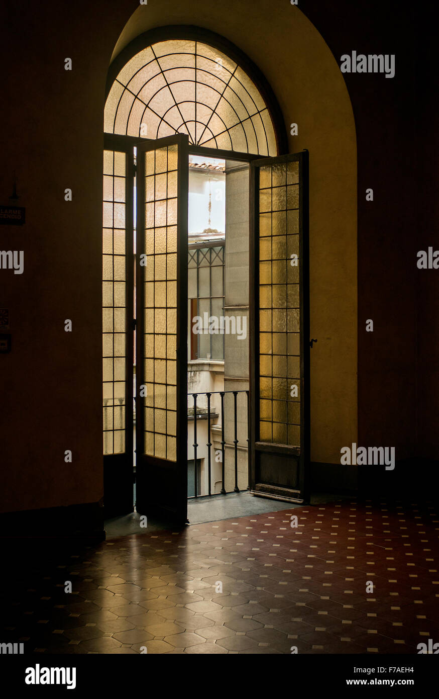 Inner hallway windows onto courtyard of Medici Riccardi Palace. Florence, Italy Stock Photo