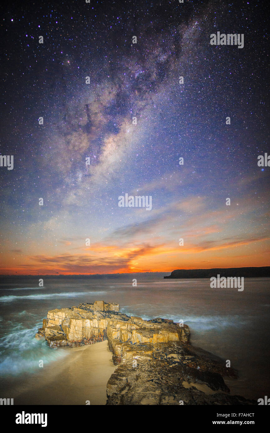 Moonrise under the milky way Stock Photo