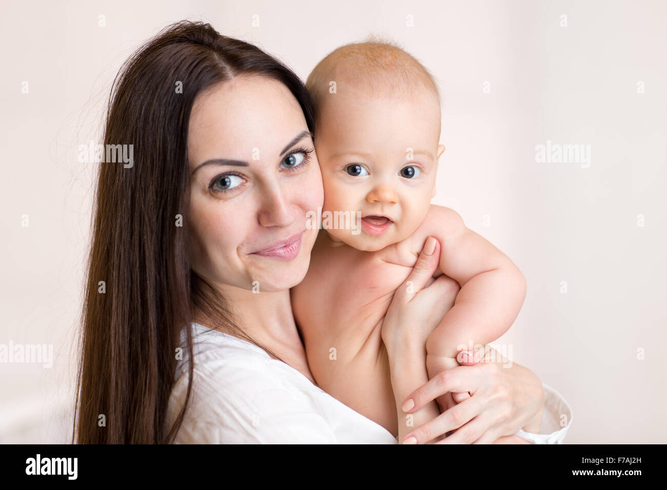 Baby and mother portrait.  Childhood, motherhood, happy family Stock Photo