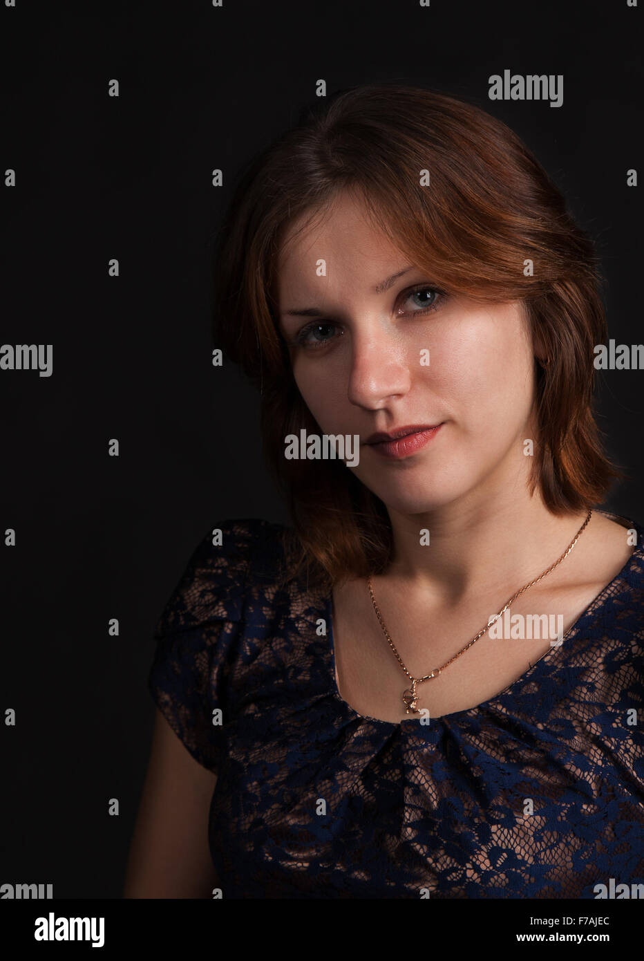 portrait of a young beautiful girl on a dark background Stock Photo - Alamy