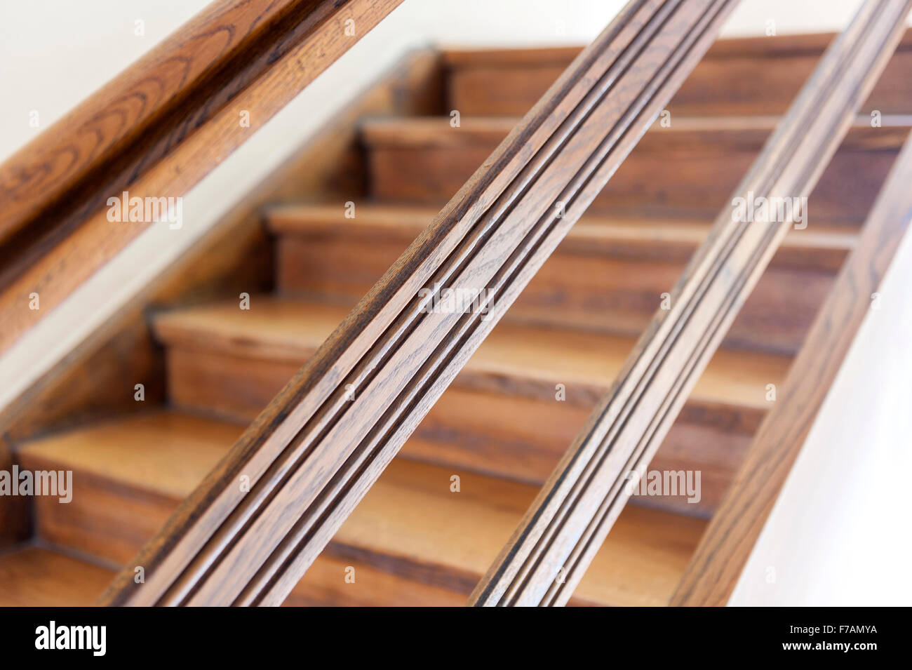 Quarter-turn concrete staircase with solid wood steps