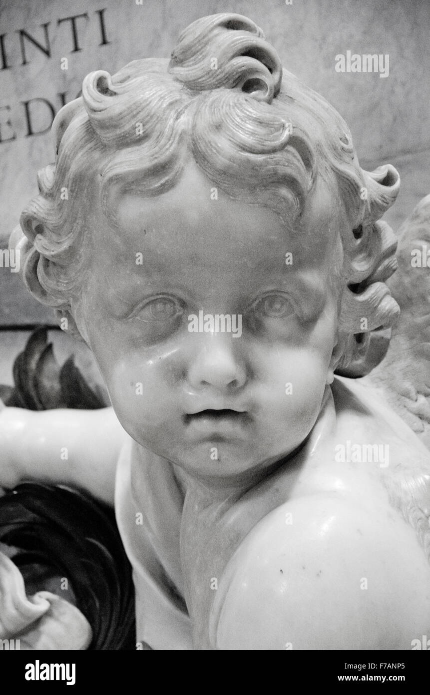 Pictured here is the face of a cherub carved in marble in St. Peter's Basilica in the Vatican. Stock Photo