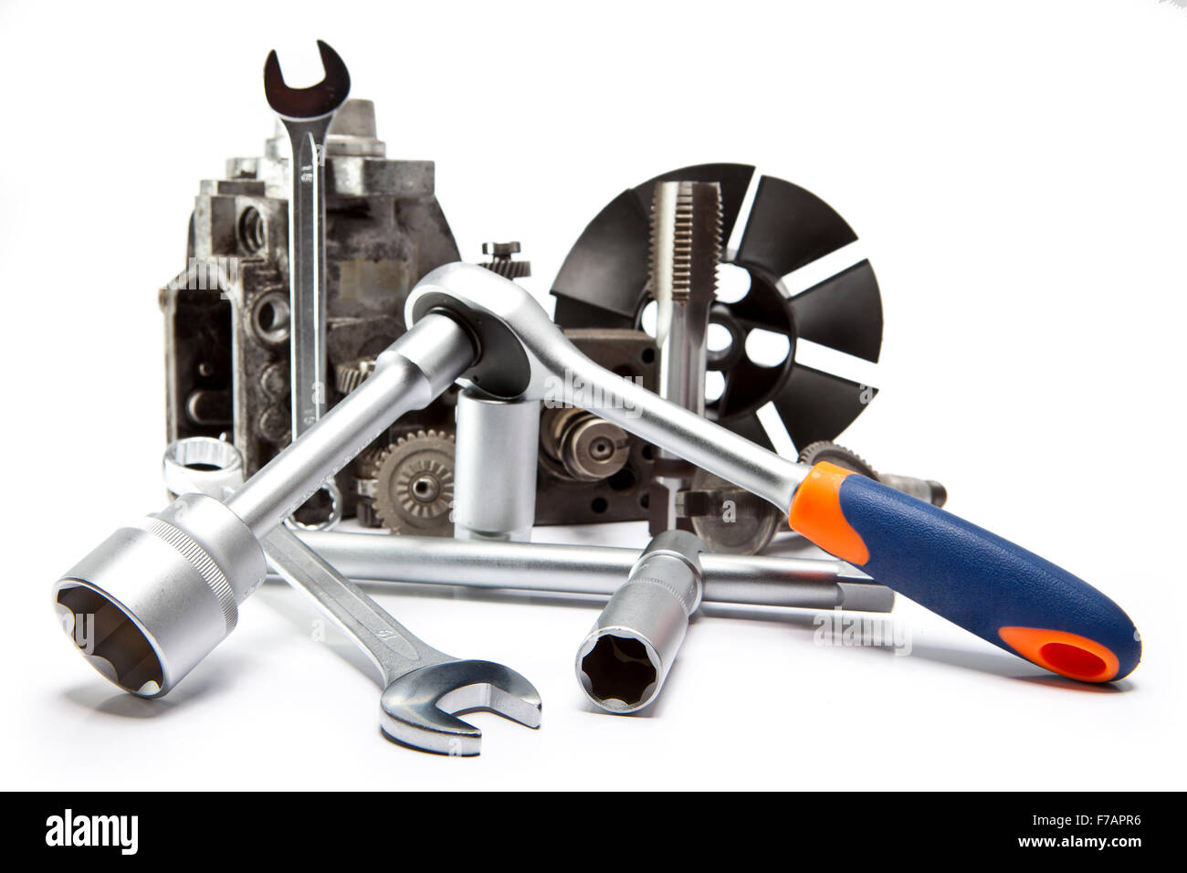 the part of car high pressure pump and the tool for repair on white