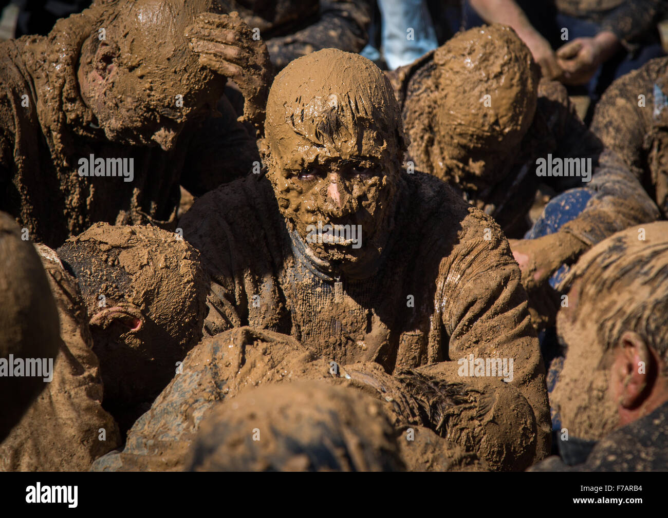 Iranian Shiite Muslim Men Covered In Mud Crying Together During Ashura, The Day Of The Death Of Imam Hussein, Kurdistan Province, Bijar, Iran Stock Photo