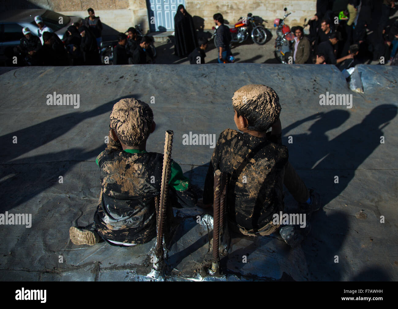 Iranian Shiite Muslim Boys Covered In Mud, Chanting And Self-flagellating During Ashura Day, Kurdistan Province, Bijar, Iran Stock Photo