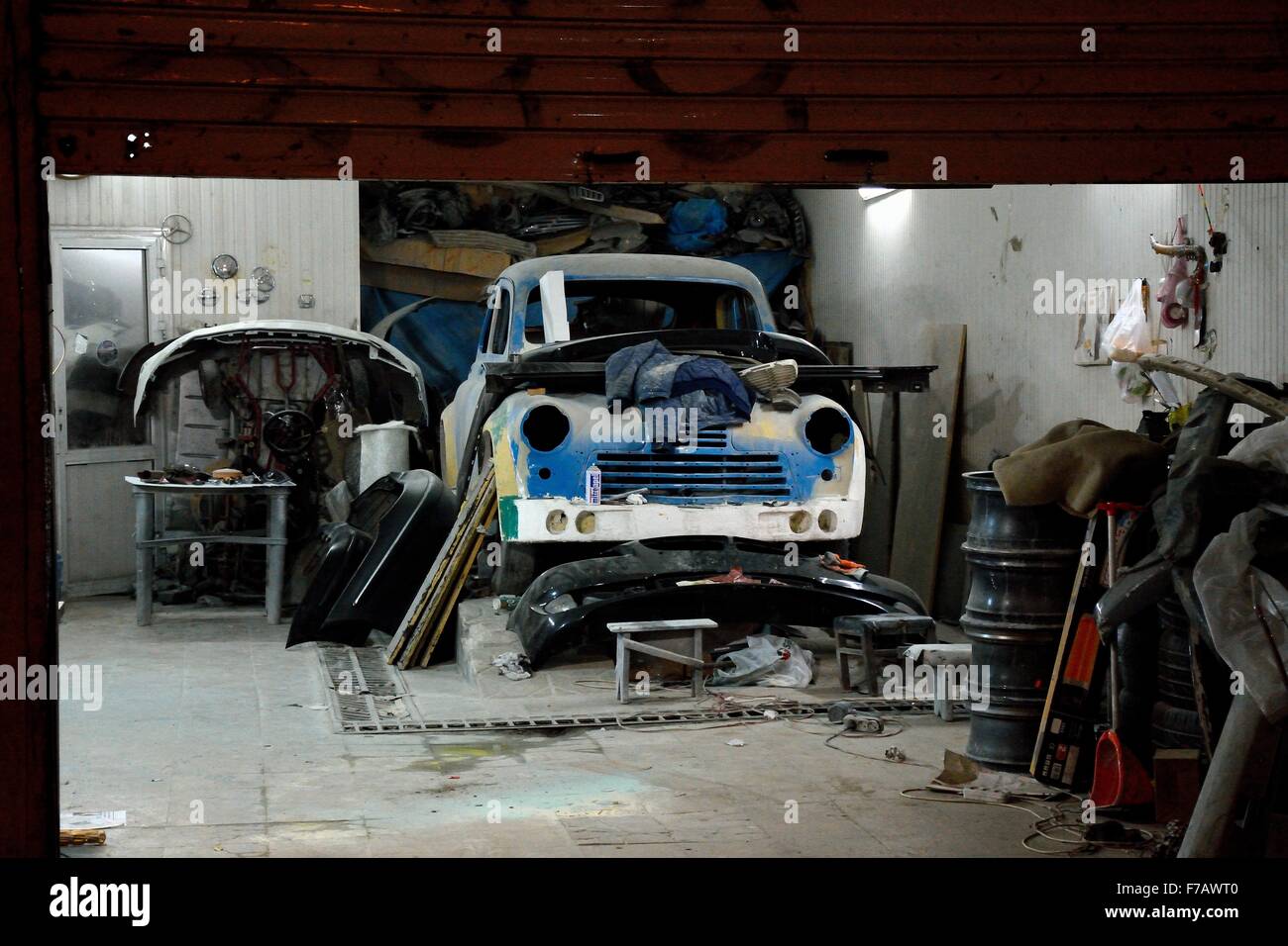 Old car being worked on in garage in Baku, capital of Azerbaijan Stock Photo