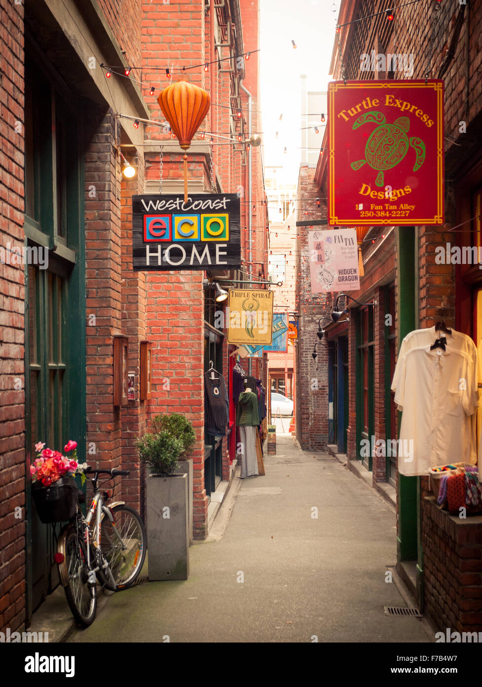 A view of Fan Tan Alley in Victoria, British Columbia, Canada.  It is the narrowest street in Canada. Stock Photo