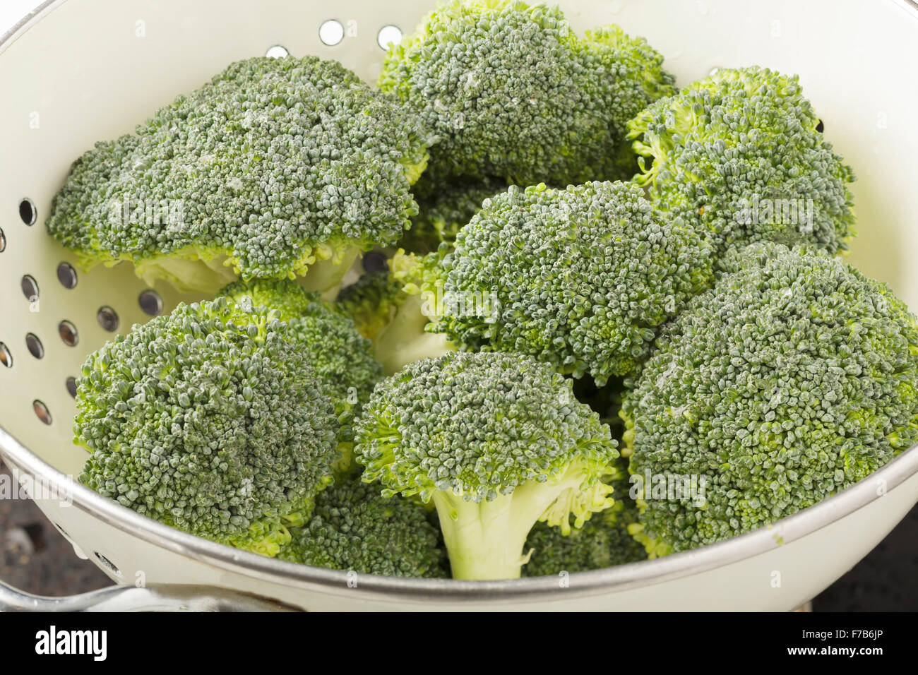Broccoli in colander Stock Photo