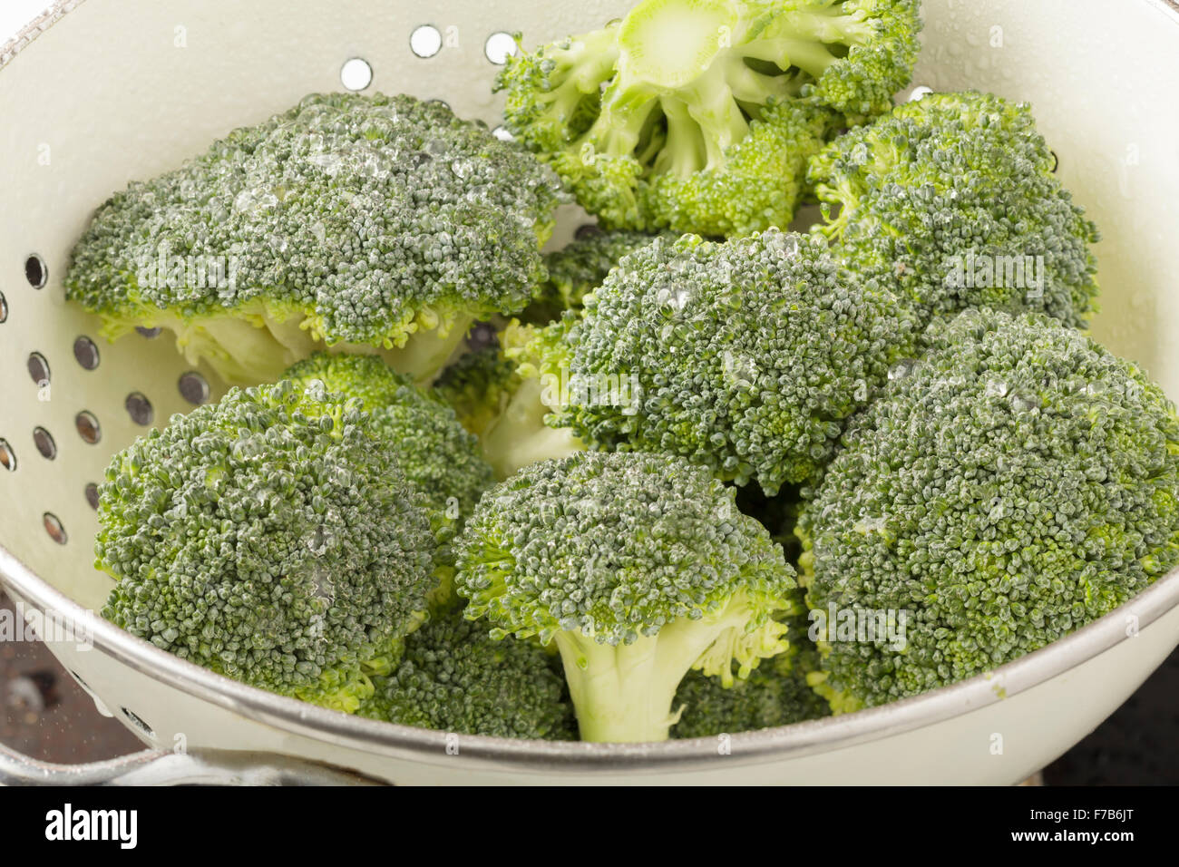 Broccoli in colander Stock Photo