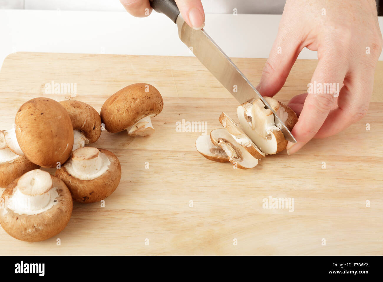 slicing mushrooms Stock Photo