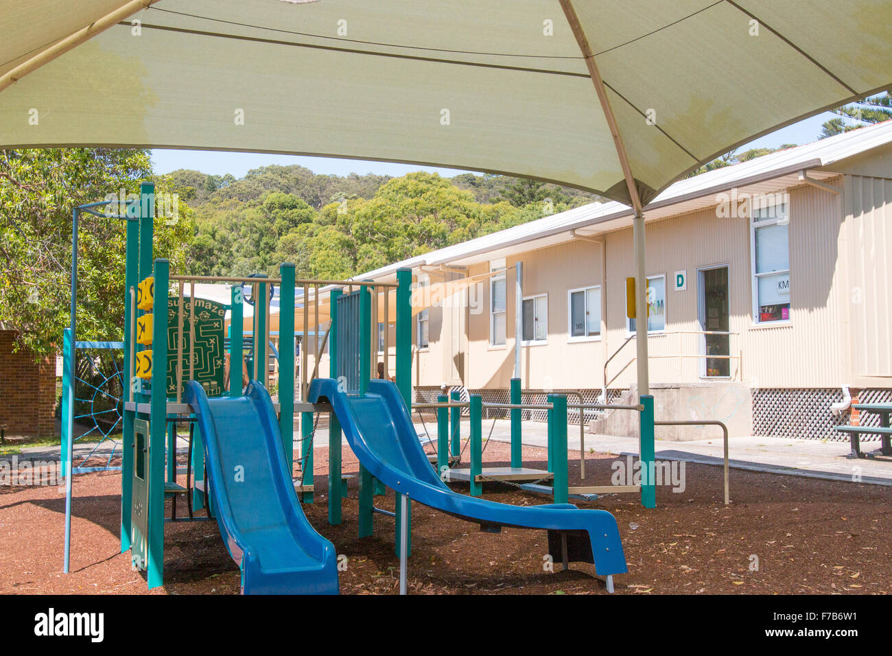 Australian school playground with sunshade cloth above and slide for children's fun,Sydney,NSW,Australia Stock Photo