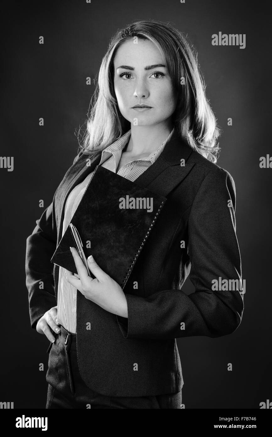 portrait of a business woman shot in the studio on gray background ...