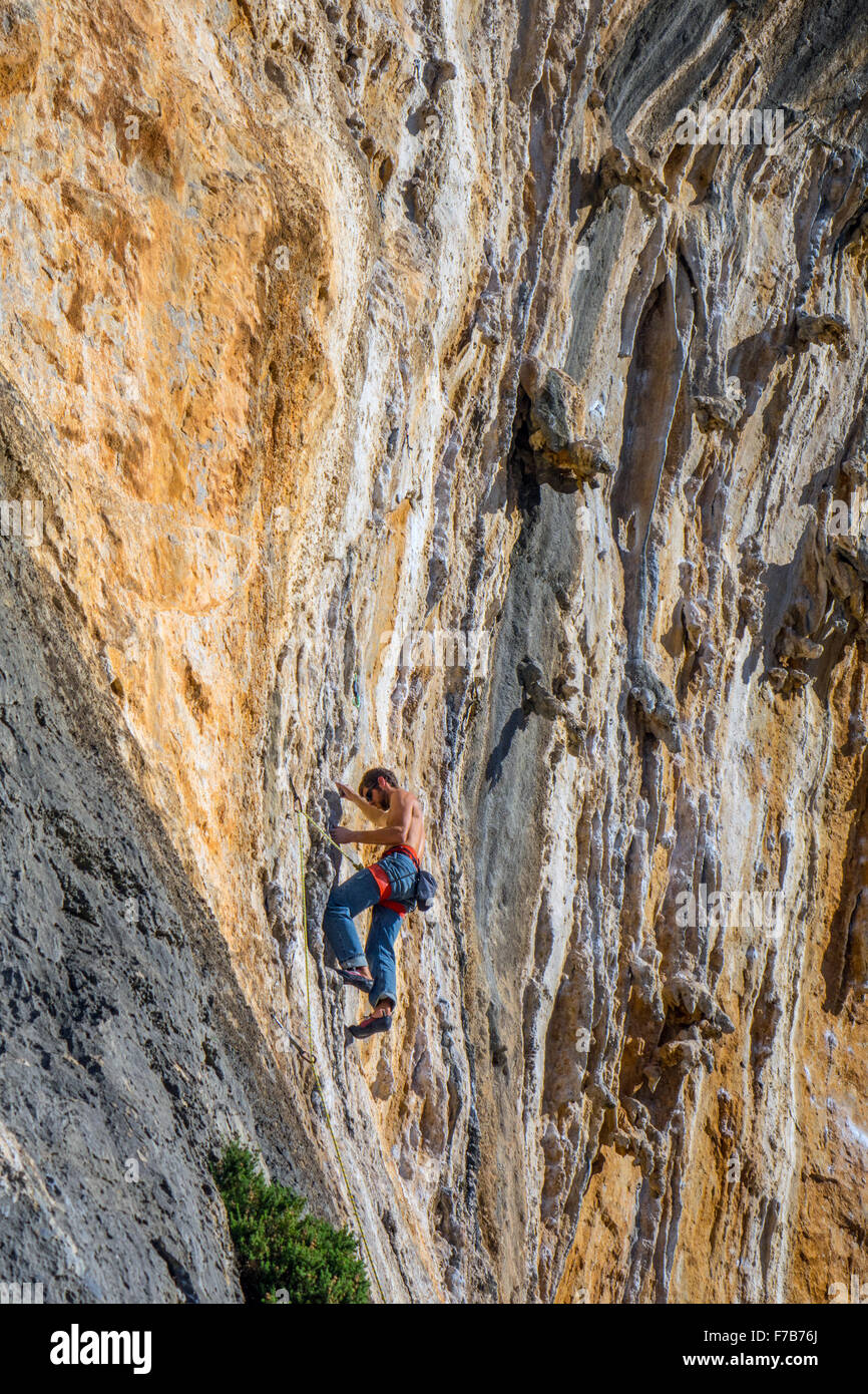Rock climber on sunny cliff, sport climbing, Kalymnos, Greece Stock Photo Alamy