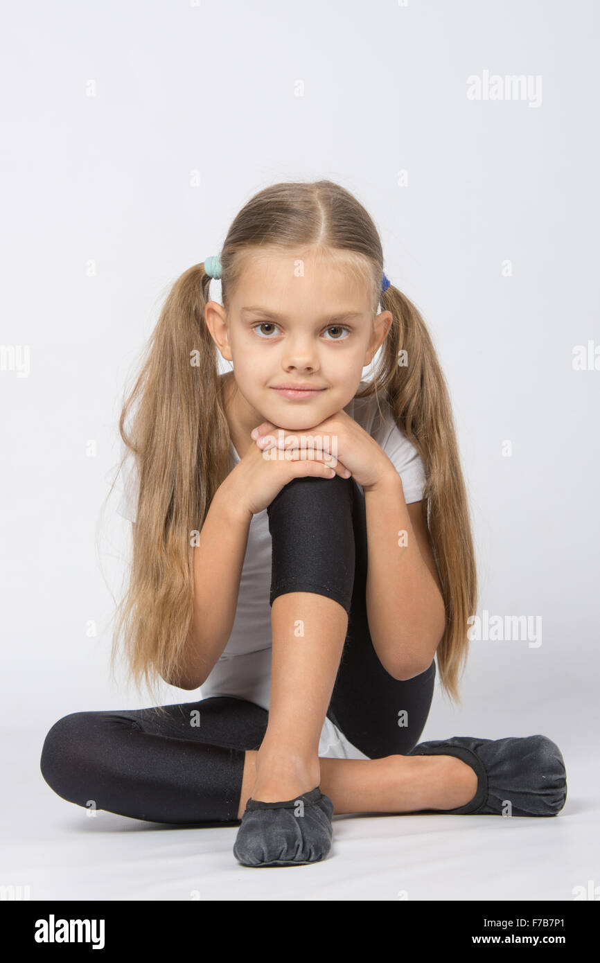 six year old girl aspiring gymnast performs a number of training