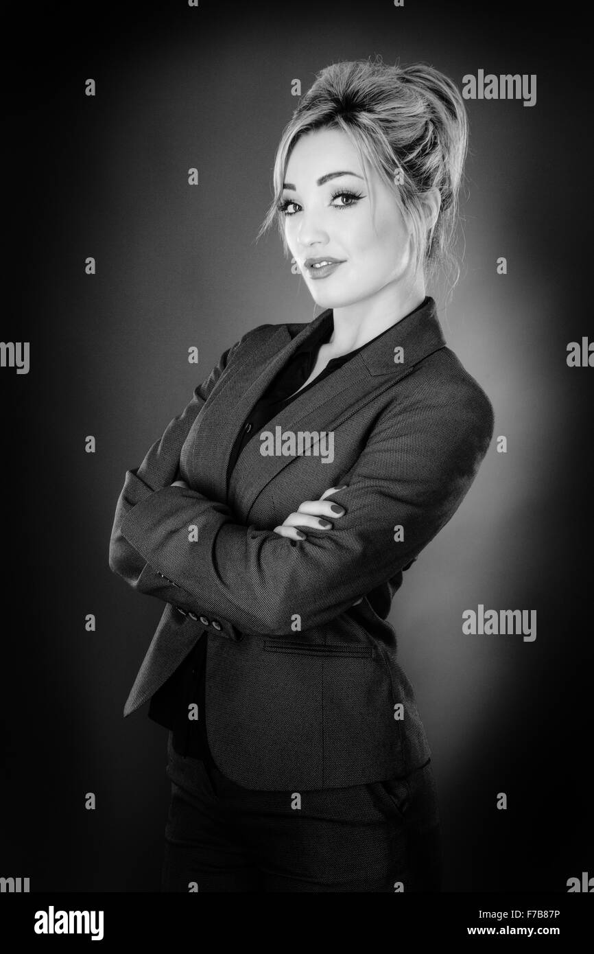 Standing business woman shot in the studio on a grey background Stock ...