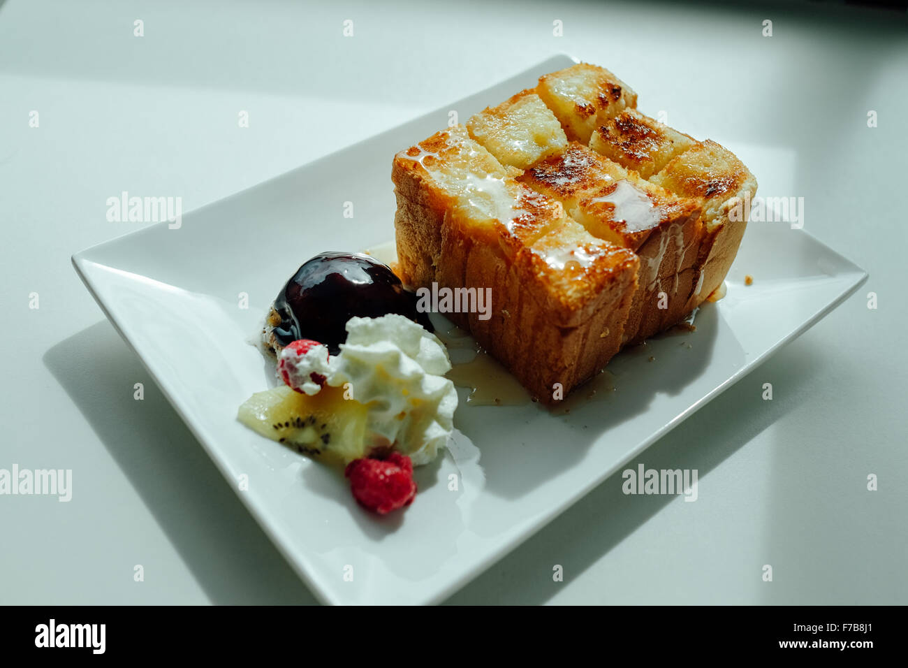 Honey Toast, served with ice-cream and chocolate Stock Photo