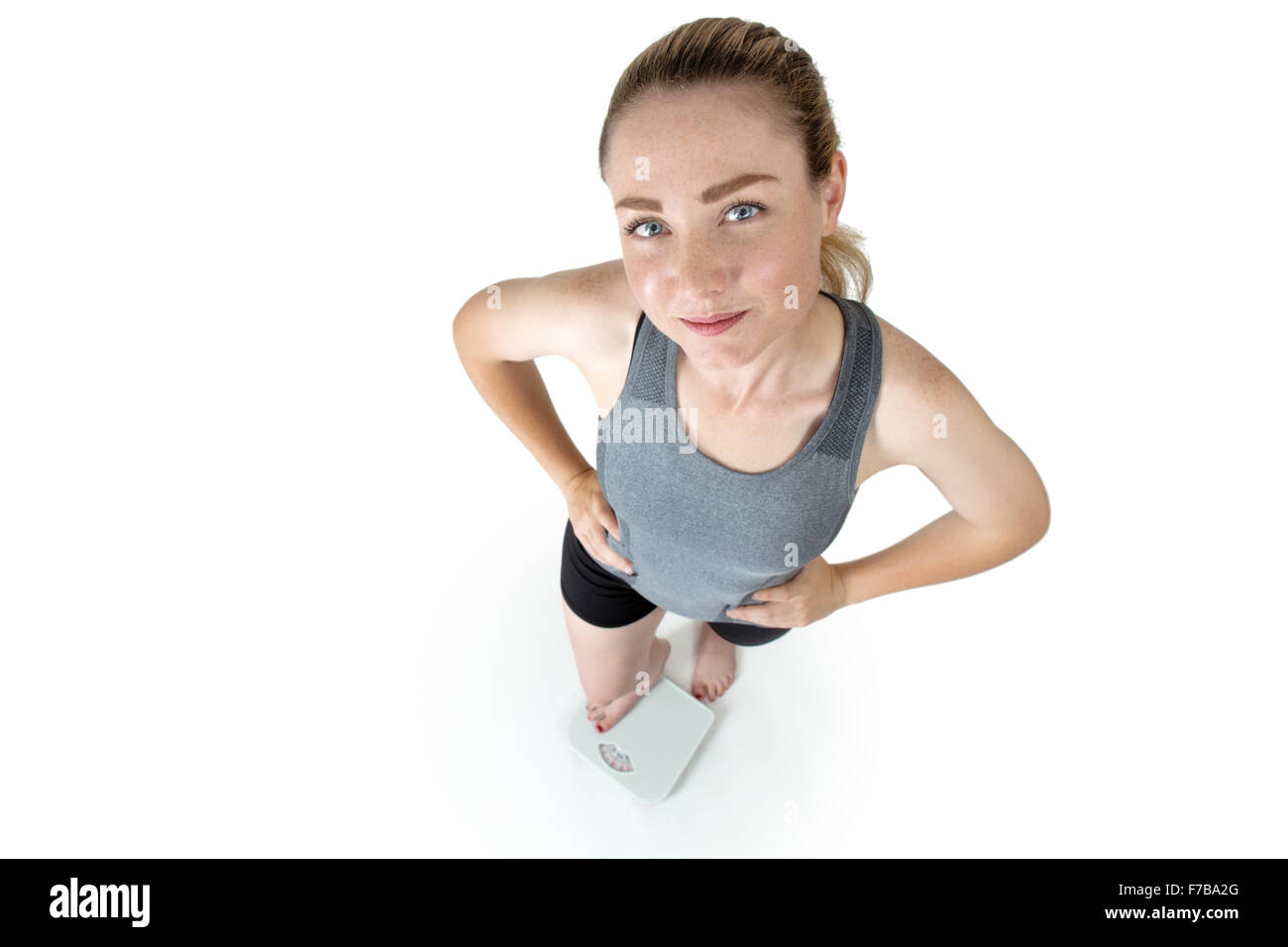 https://c8.alamy.com/comp/F7BA2G/shot-taken-from-above-of-a-slim-woman-in-her-gym-clothes-hands-on-F7BA2G.jpg
