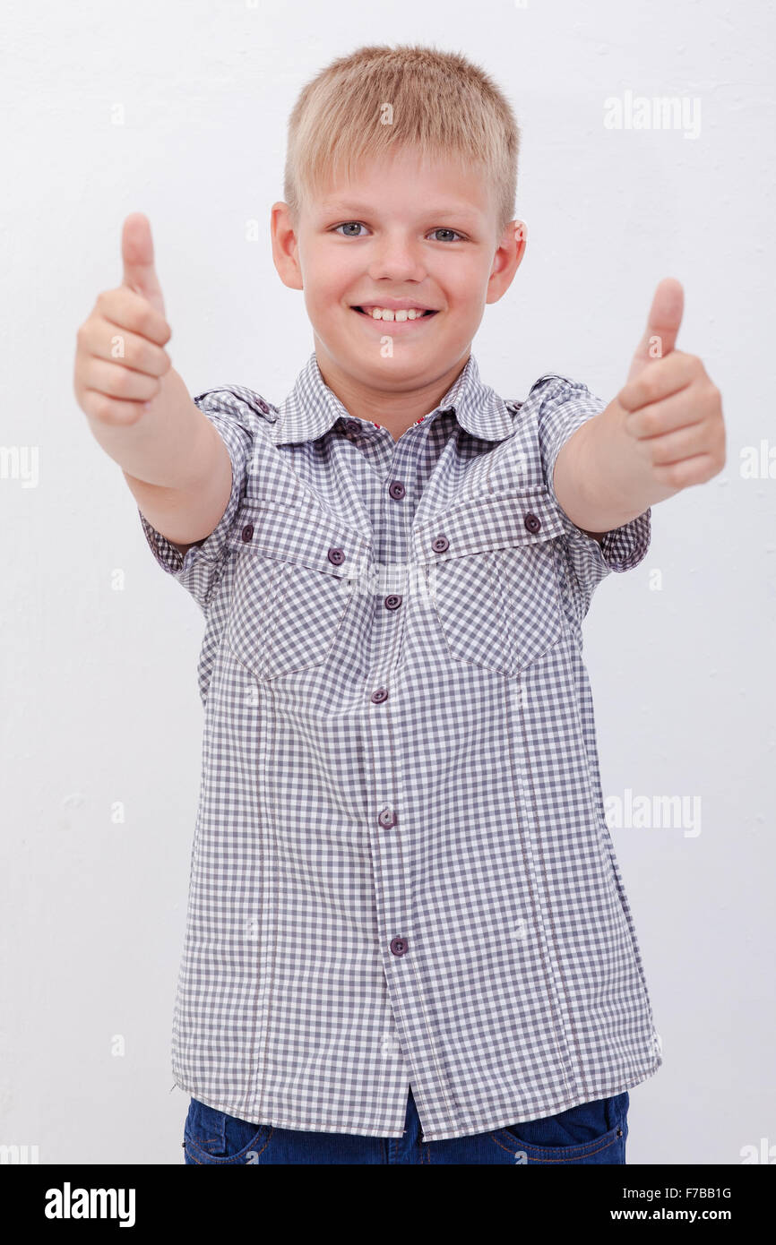 Portrait of happy boy showing thumbs up gesture Stock Photo - Alamy