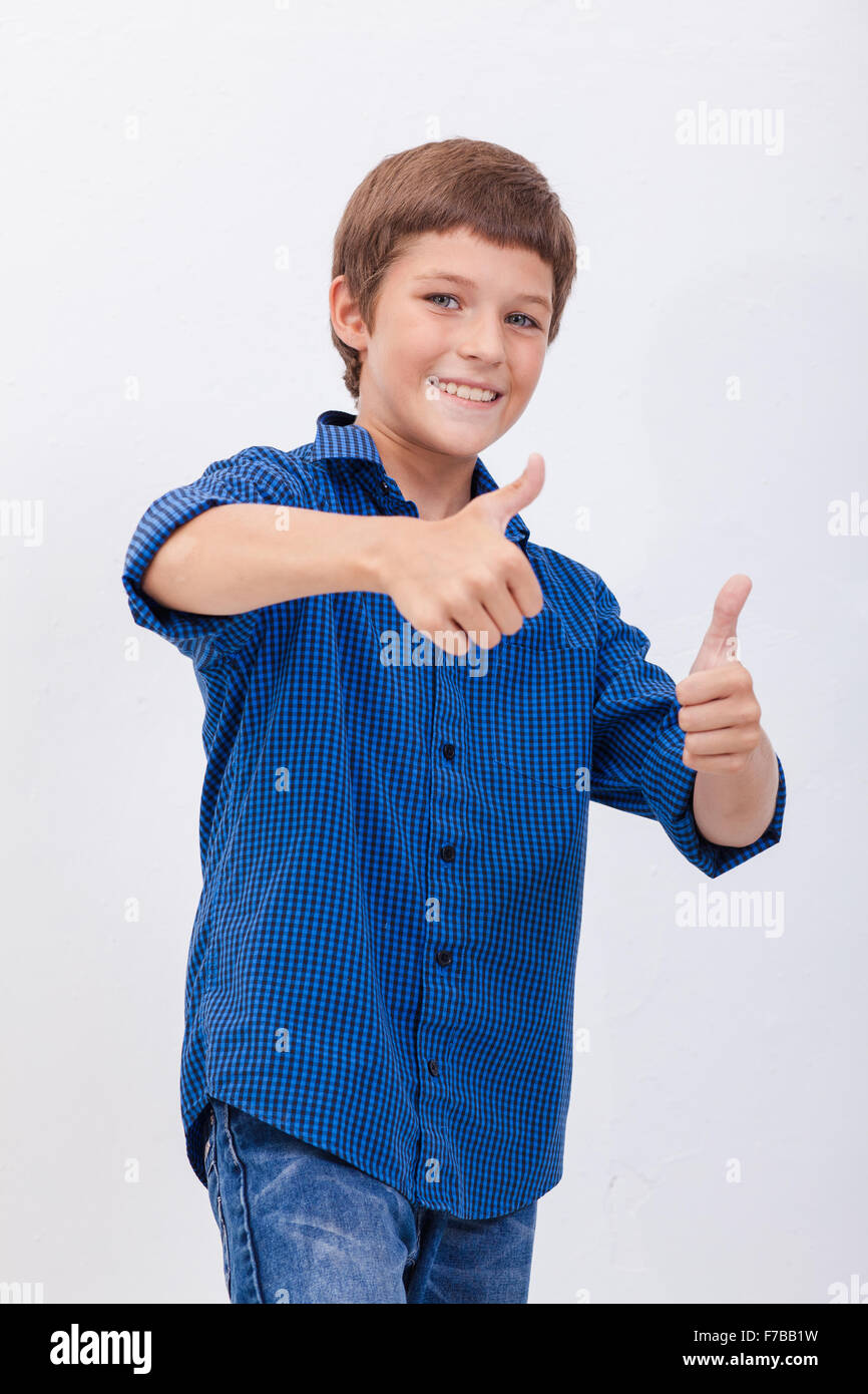 Portrait of happy boy showing thumbs up gesture Stock Photo - Alamy