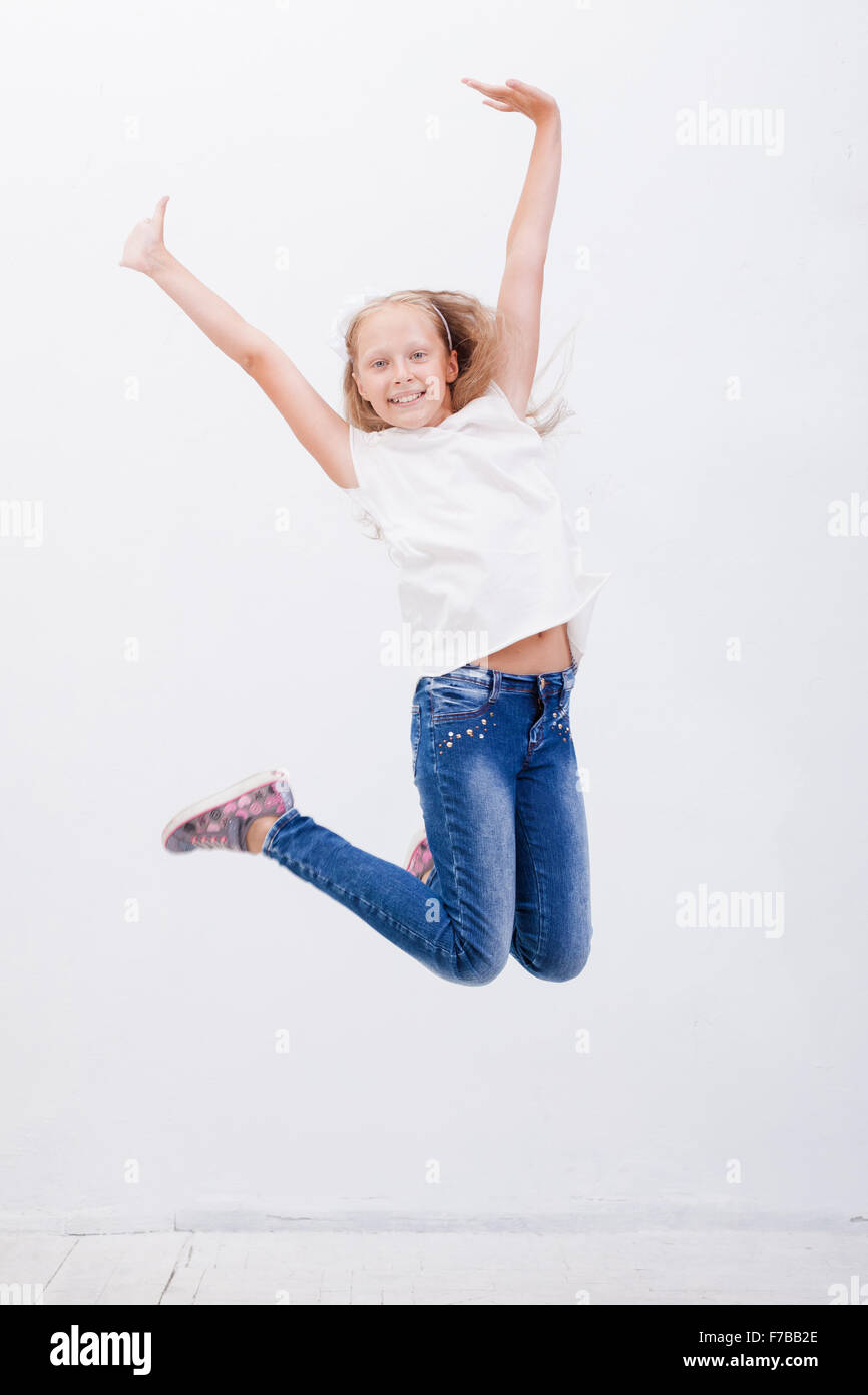 Happy Young Girl Jumping On White Background Stock Photo Alamy Happy Young Girl Jumping On White Background Stock Photo Alamy