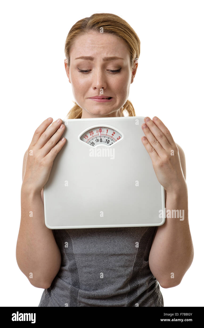https://c8.alamy.com/comp/F7BBGY/fitness-woman-holding-scale-unsure-and-afraid-to-weight-herself-F7BBGY.jpg