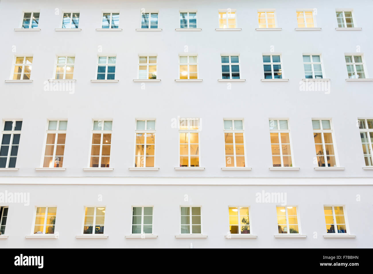 Multiple windows on a large office building. Stock Photo