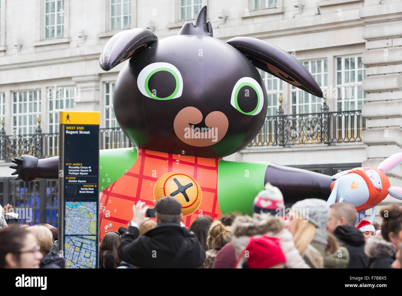 London, UK. 28 November 2015. A giant inflatable Bing with his favourite  toy Hoppity Voosh. The inaugural Hamleys Christmas Toy Parade takes place  along Regent Street, which went traffic-free for the day.