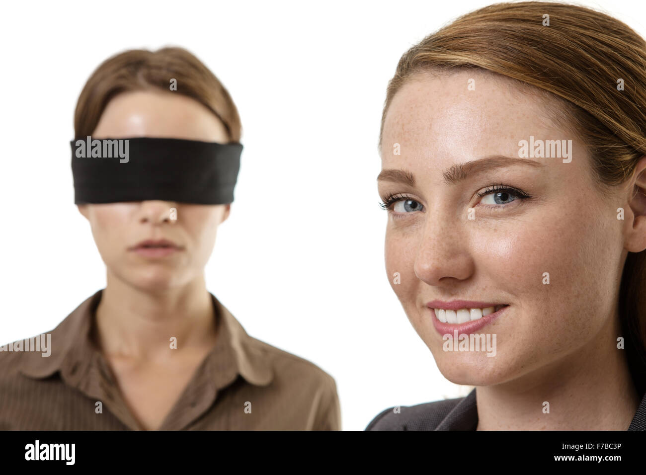 confused blindfolded woman on a white background Stock Photo