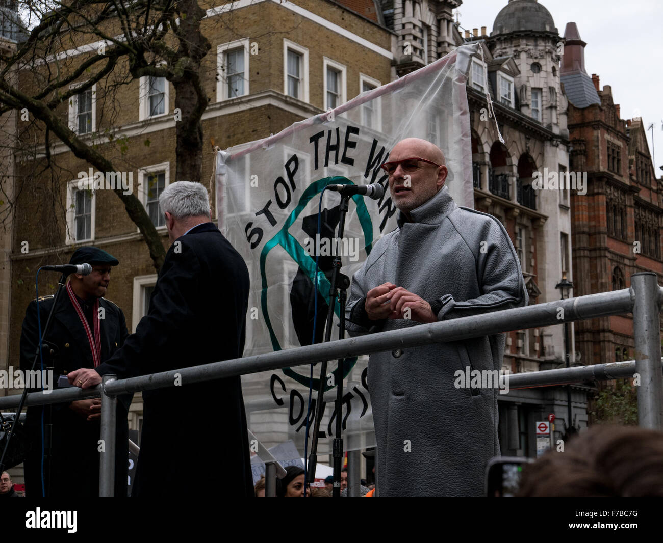 Westminster, London, UK. 28th November,2015. Brian Eno of Roxy Music fame, addresses protesters at the stop the war demonstration outside Downing Street © Credit:  Oliver Lynton/Alamy Live News Stock Photo