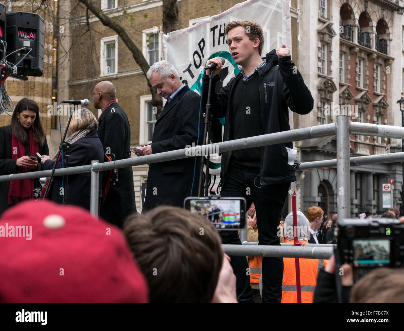 Westminster, London, UK. 28th November,2015. Own Jones addresses protesters at the stop the war demonstration outside Downing Street © Credit:  Oliver Lynton/Alamy Live News Stock Photo