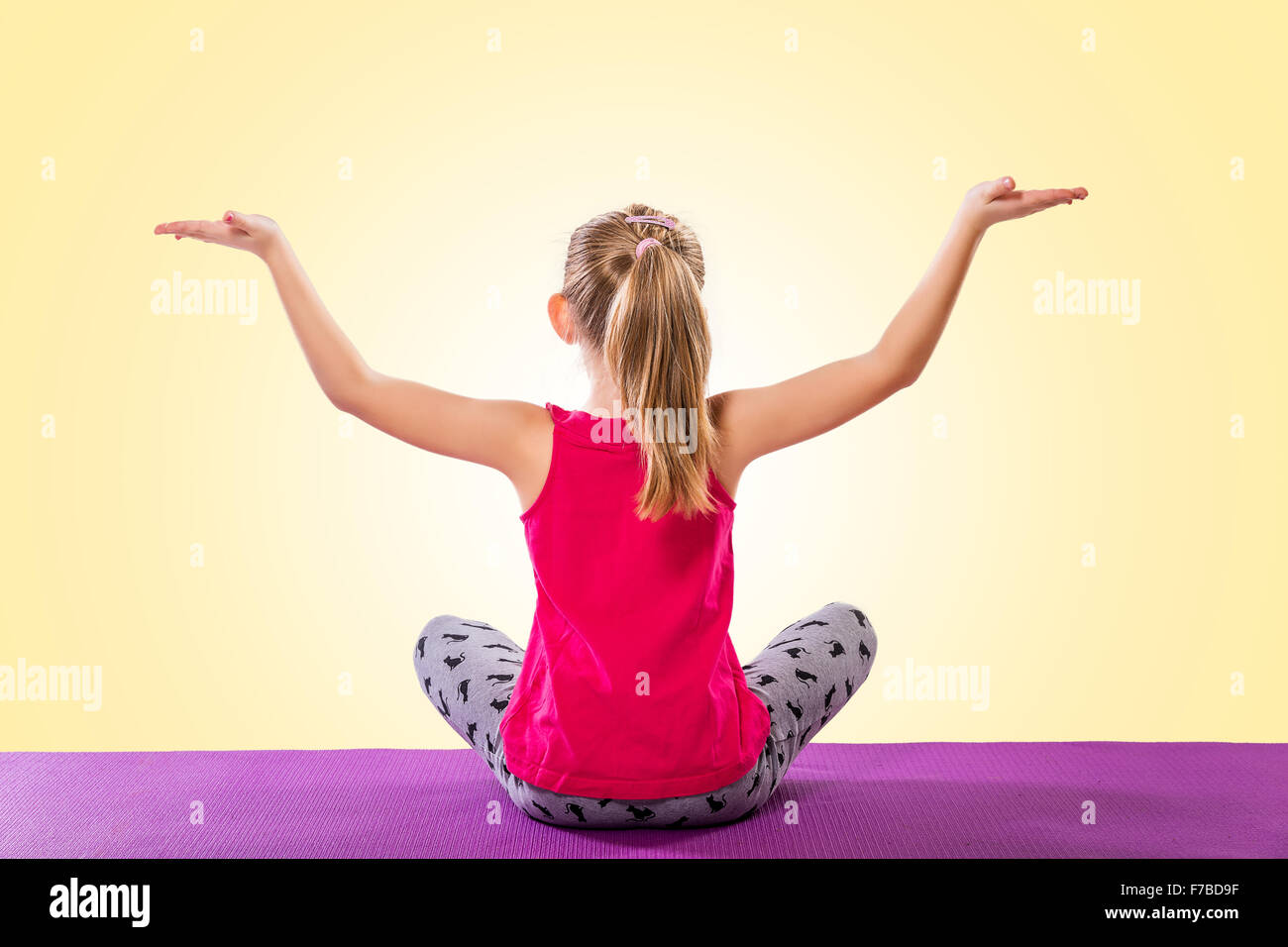 Little girl sitting in yoga pose Stock Photo