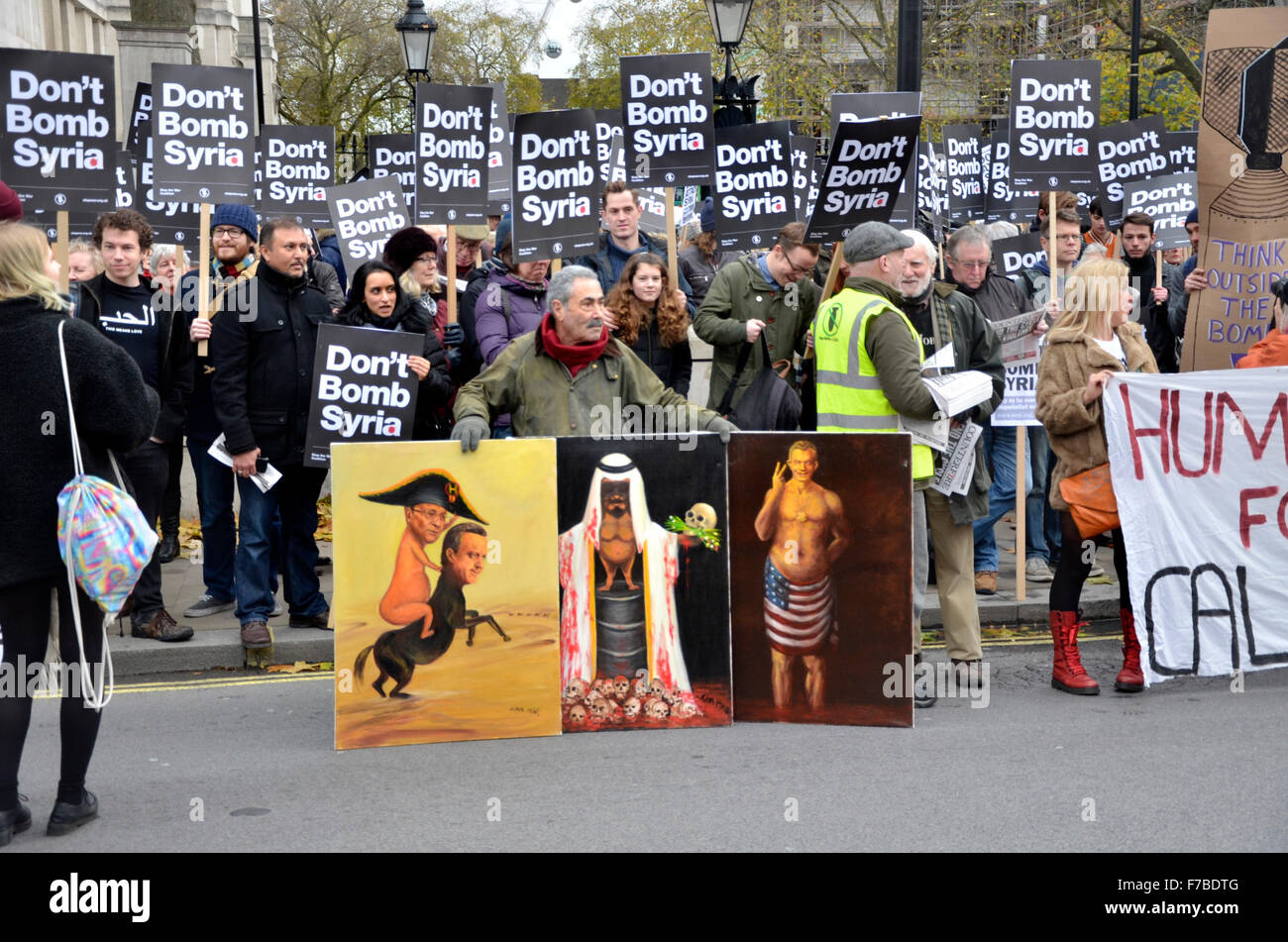 London, UK. 28th November, 2015. Thousands gather outside Downing Street to protest against UK aircraft bombing Syria. Kaya Mar, satyrical artist Credit:  PjrNews/Alamy Live News Stock Photo
