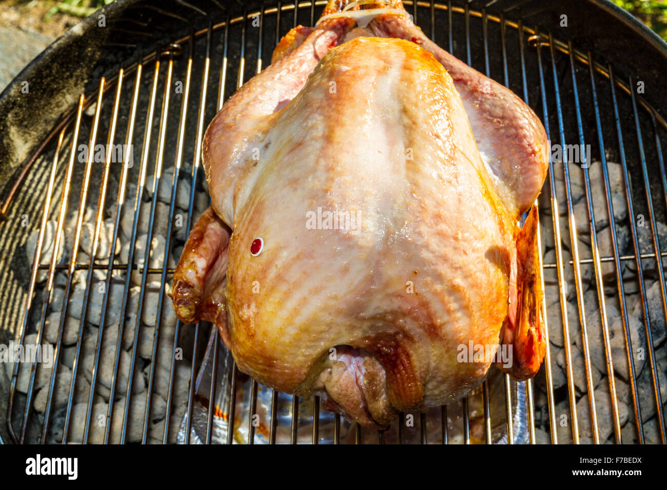 A salt rub brined Thanksgiving Turkey cooked on a er Kettle barbecue