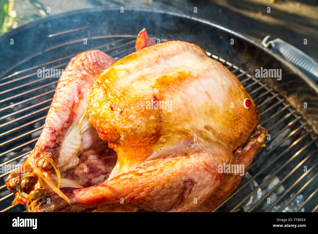 A salt rub brined Thanksgiving Turkey cooked on a er Kettle barbecue