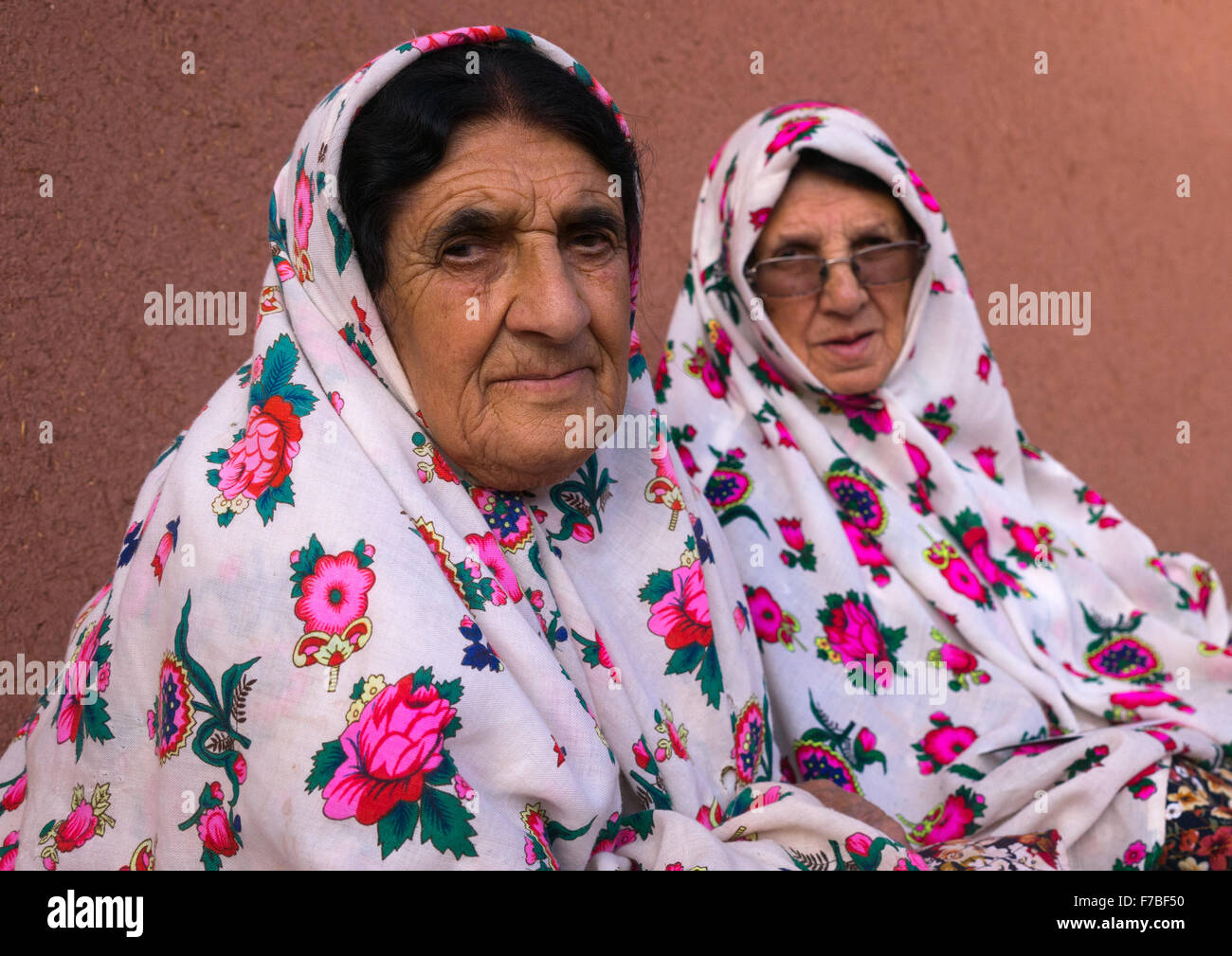 Portrait Of Iranian Women Wearing Traditional Floreal Chadors In Zoroastrian Village, Isfahan Province, Abyaneh, Iran Stock Photo