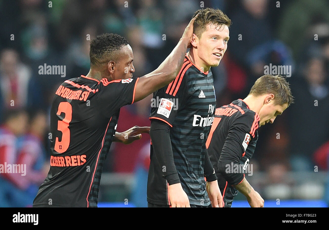 Hamburg's Michael Gregoritsch (c) celebrates his goal at 0:2 with Cleber Janderson Pereira Reis (l) and Ivo Ilicevic during the German Bundesliga football match between Werder Bremen and Hamburger SV at the Weserstadion in Bremen, Germany, 28 November 2015. PHOTO: CARMEN JASPERSEN/DPA     (EMBARGO CONDITIONS - ATTENTION: Due to the accreditation guidelines, the DFL only permits the publication and utilisation of up to 15 pictures per match on the internet and in online media during the match.) Stock Photo