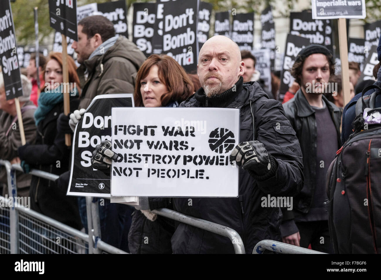London, UK, 28th November, 2015.  Demonstrators hold up their placards in protest at the UK government proposal to commence bombing Syria.  Credit: Gordon Scammell/Alamy Live News Stock Photo