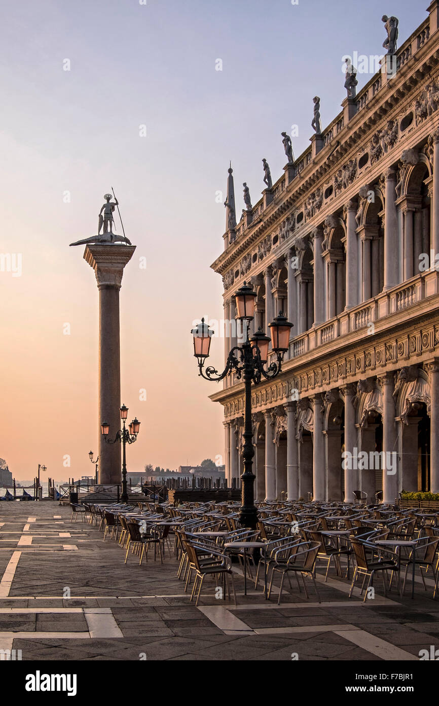 Venice, Italy. Biblioteca Nazionale Marciana, National library facade & Saint Theodore's granite column at sunrise Stock Photo
