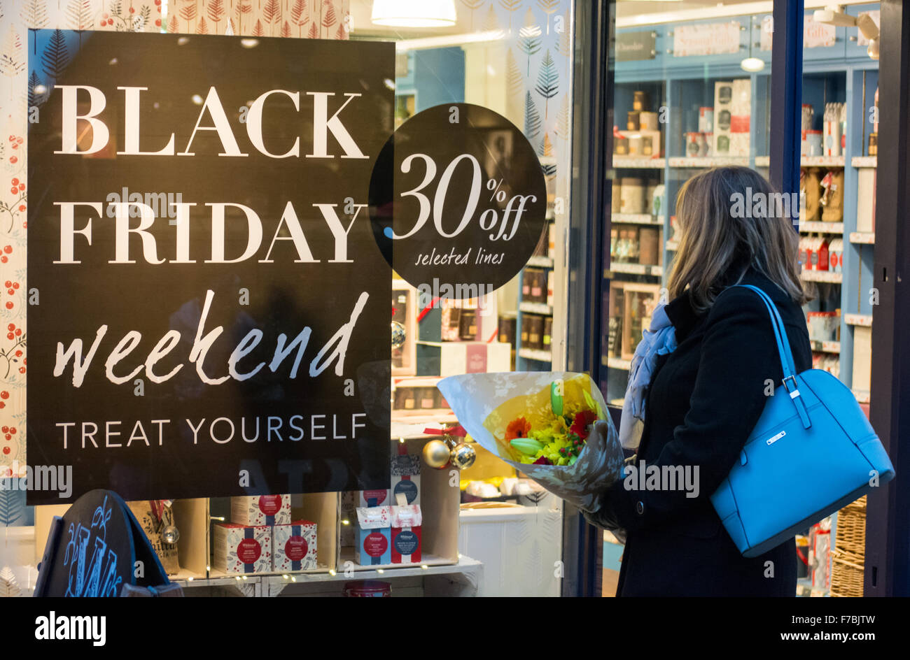 Salisbury, Wiltshire, UK. 28th November 2015. Woman shopping on Black Friday for offers as the UK takes a more relaxed approach to the US originated event. Stock Photo