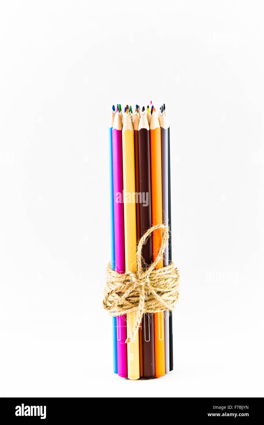 Bundle of coloured pencils tied together with jute twine Stock Photo