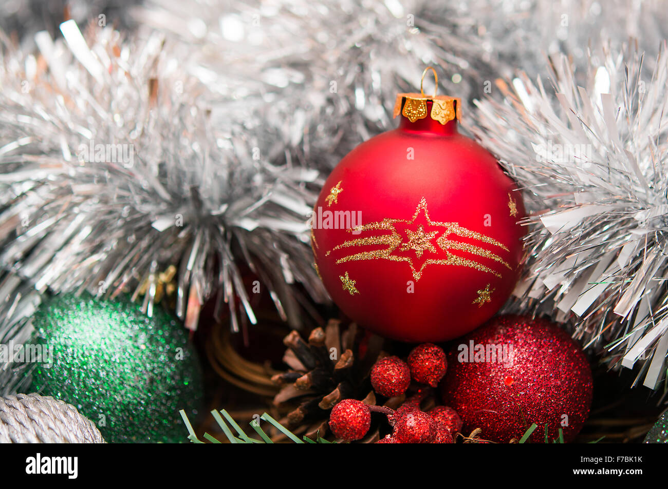 New Year composition with red ball and tinsel Stock Photo