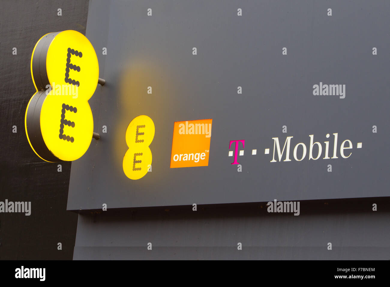 EE Orange & T Mobile mobile network brand logos on high street Stock Photo