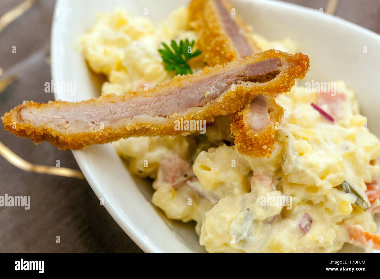 Potato salad with Viennese schnitzel Traditional Czech dish for Christmas dinner Stock Photo