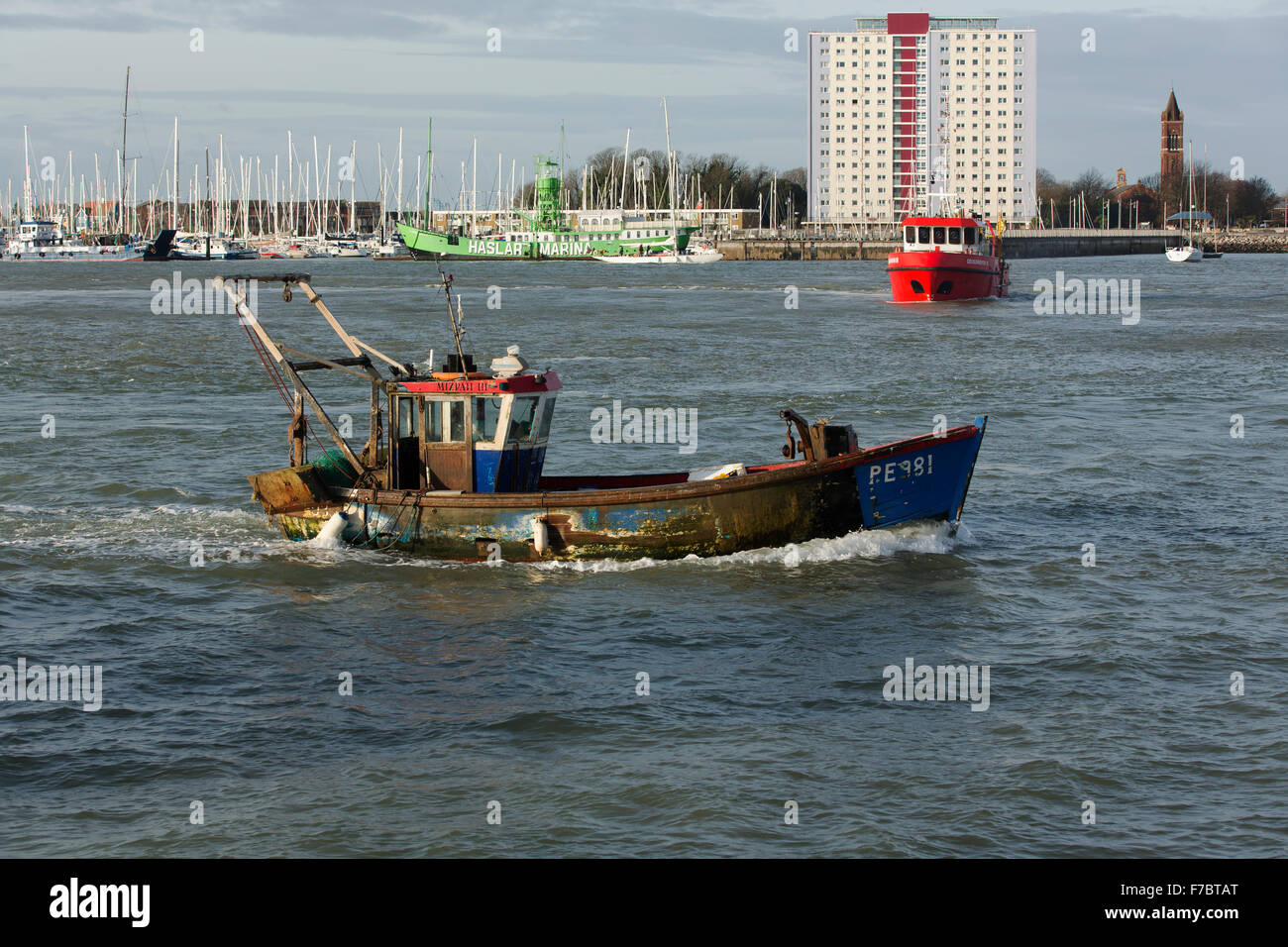 Small fishing boat entering harbour hi-res stock photography and images ...