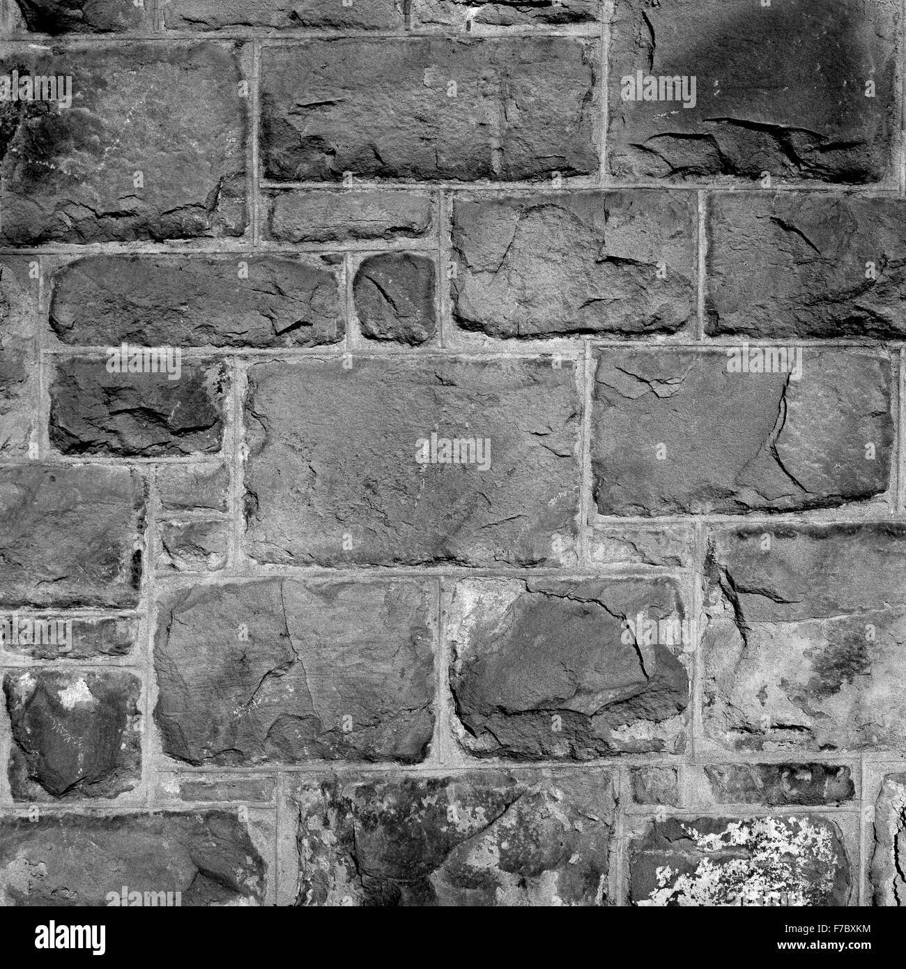Close up detail in black and white of a stone/brick wall (medium format B&W film). Stock Photo