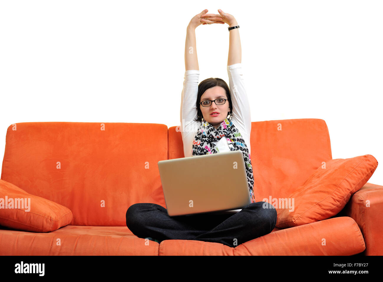 Woman at home, on sofa with laptop computer Stock Photo - Alamy