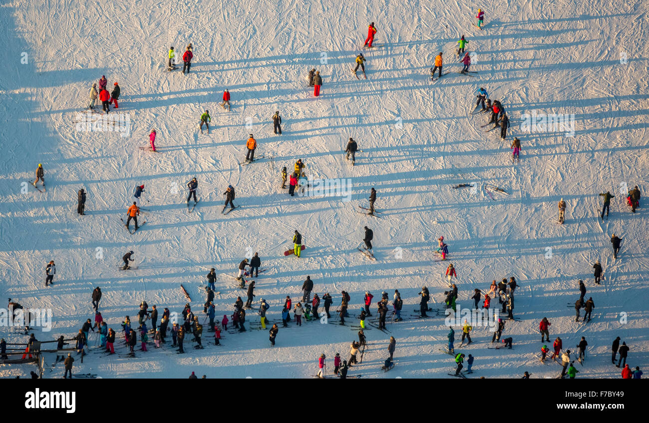 Skiers on ski lift, Winterberg, Hochsauerlandkreis, downhill skiing Nordrhein-Westfalen, Germany, Europe, Aerial view Stock Photo