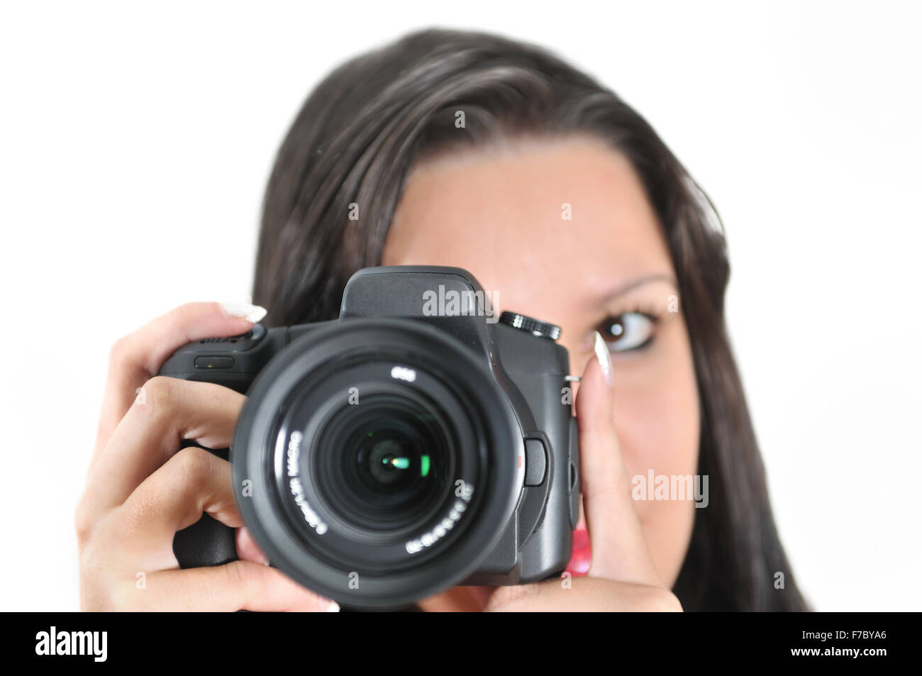 Young woman holding camera in hand taking picture isolated Stock Photo ...